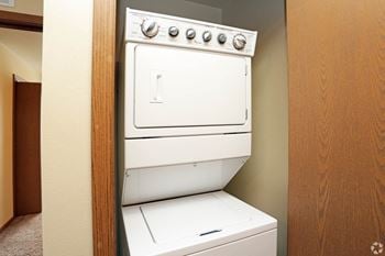 a washer and dryer in a room at Benson Village Townhomes, Sioux Falls, 57104